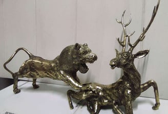 "Handcrafted brass sculpture of a lion hunting a deer-Qualified for export"