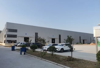 View our Zorylift loader crane plant: a large production facility with dedicated loading bays for seamless global shipping.