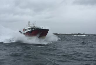 a boat in the ocean with a boat in the water