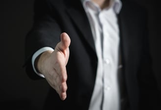 A businessman offering his hand to shake