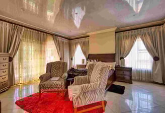 Expert installing custom drapes for luxury home decor