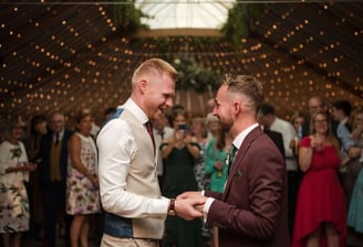 Two men hold hands on their wedding day