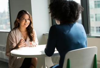 two women are talking