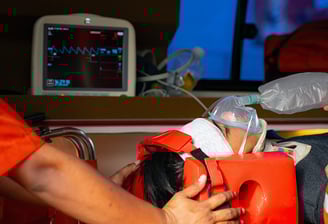 Injured teen, boarded in an ambulance receiving air by hand