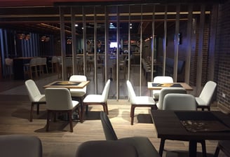 a restaurant with a view of a city skyline