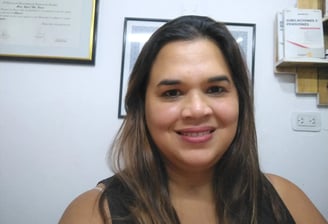 a woman with long hair and a necklace