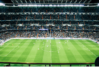 Wide view of a football stadium full of supporters