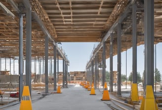 low angle photography of cranes on top of building