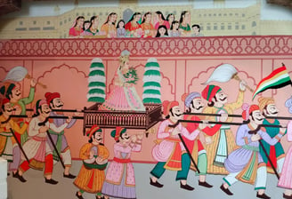 A vibrant mural showcasing Indian individuals engaged in Rajasthani Gangaur cultural activities