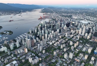a cityscape of a large city with a river in the background