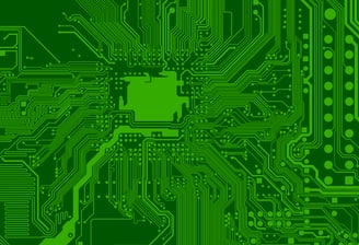 a green computer circuit board with a circuit boarder