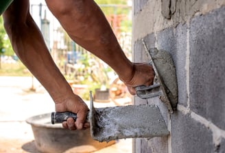 hawk and trowel used to spread concrete stucco and parging