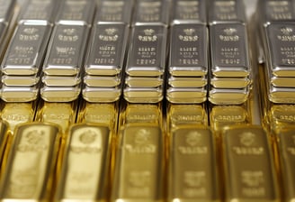 gold and silver bullion bars in rows and stacks