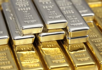 gold and silver bullion bars stacked