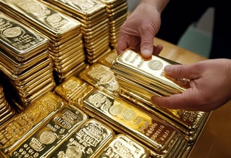 gold bullion bars in stacks