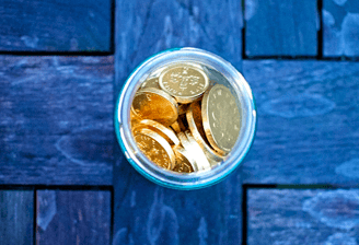 gold coins in glass for gold ira