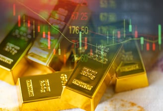 gold bars with investing charts for stock