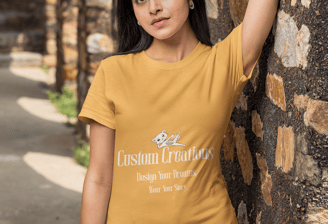 a woman in a yellow shirt is leaning against a stone wall