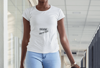 a woman in ripped jeans and a white t - shirt