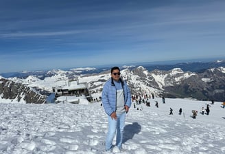 a man standing on a snowy mountain top