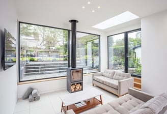 a living room with a fireplace and a fireplace