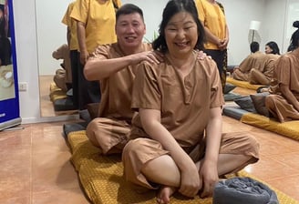 a group of people partaking in thai massage class