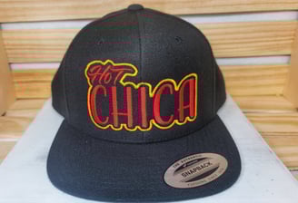 Black snapback hat with bold red and yellow Hot Chica embroidery – custom streetwear cap by Stitch &
