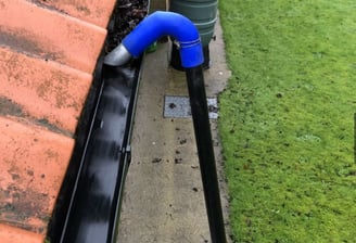 professional gutter clean being preformed for a local customer