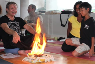 man performing a fire ritual