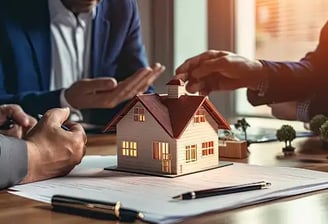 Real estate professionals discussing property maintenance and management with a miniature house mode
