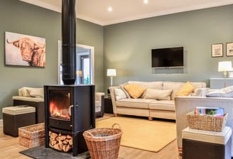 Comfortable lounge with logburner and sofas