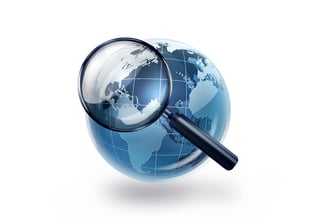 World globe and a magnifying glass