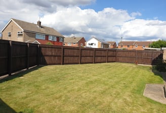 After photo of a freshly painted garden fence in Hull, showcasing a smooth, clean finish and enhanced kerb appeal