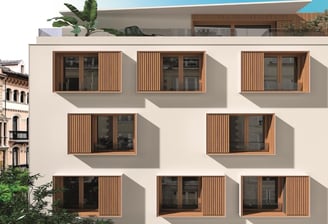 Edificio de apartamentos con volúmenes geométricos y cerramientos exteriores de líneas limpias