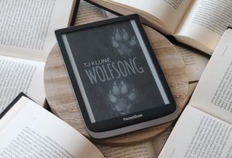 a tabletop with a book and a book on it wolfsong tjklune