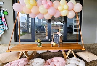 teepee picnic table hire daisy bloom with balloon garland