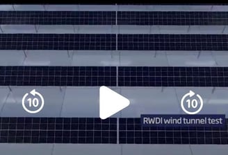 a video of a building with a number of different types of solar panels