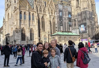 family in front of notre dame cathedral