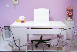 a desk with a chair and a desk with a chair