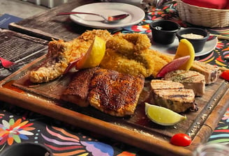 a wooden cutting board with a variety of food items