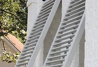 exterior bahama shutters showing a faux tilt rod design