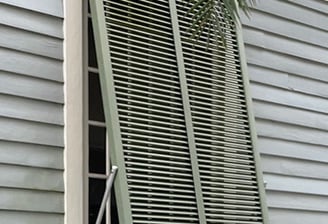 green bahama shutter on a house in new orleans
