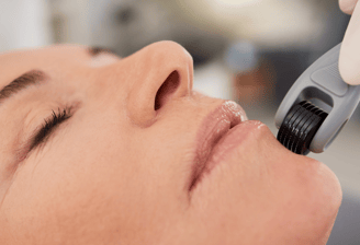 a woman is getting her teeth brushed with a brush