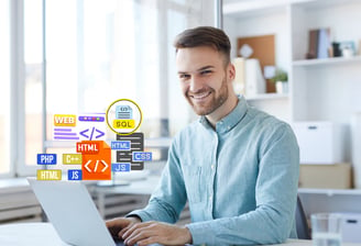 a man sitting at a table with a laptop and with web design icons 