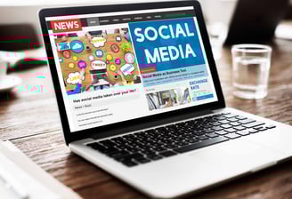 a laptop computer screen displaying a social media page on a news page