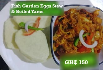 fish garden egg stew and boiled yams at de place restaurant gh
