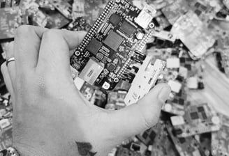 a person holding a cell phone in their hand
