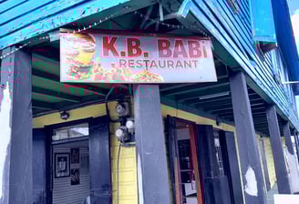 Front view of K.B BABI Restaurant located on Newgate ST and Popeshead St in St Johns, Antigua.