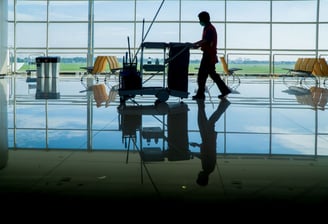 a man walking through a large room with chairs and chairs
