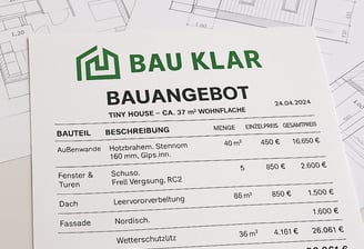 a paper house with a price tag on it